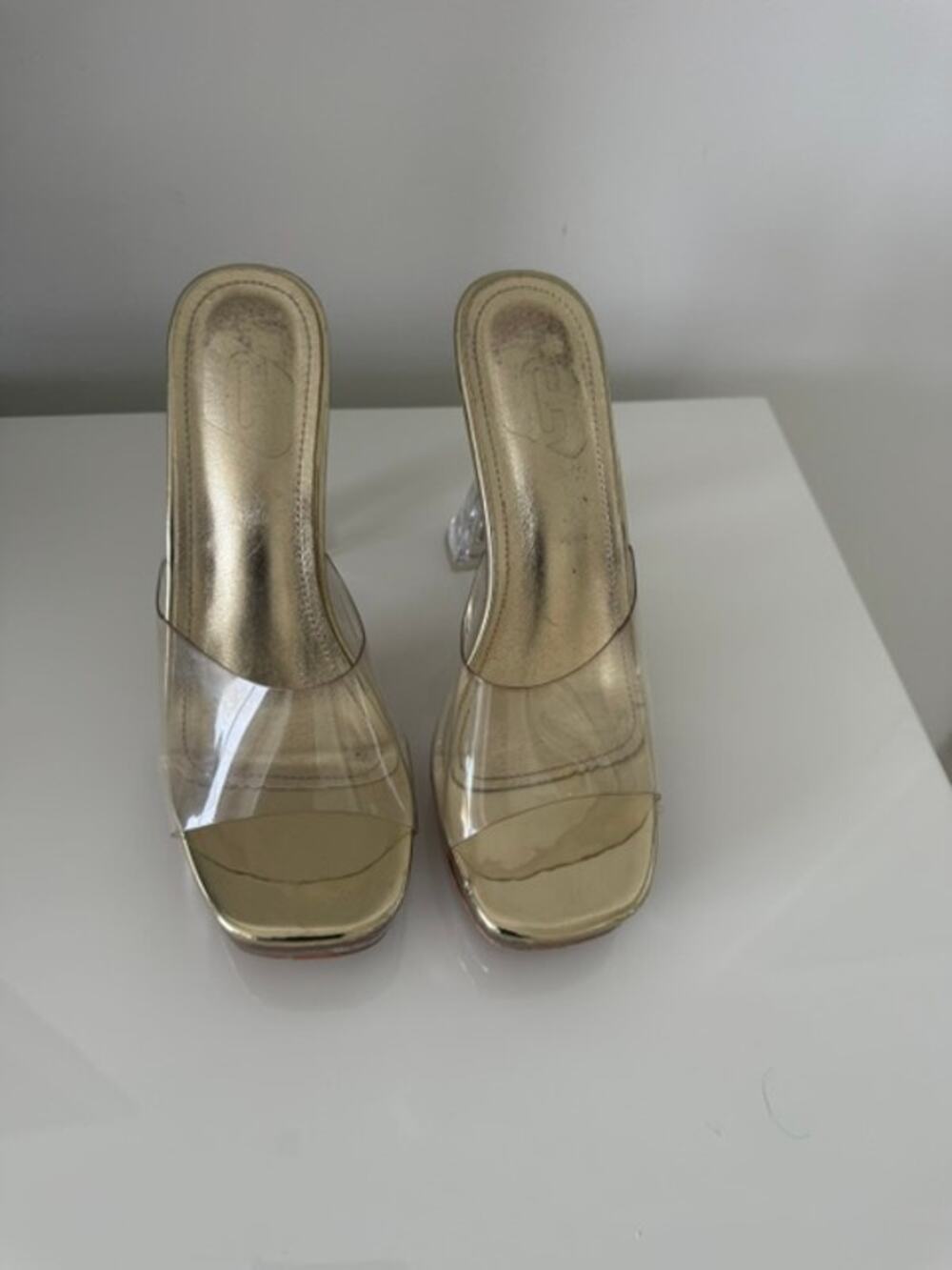 Clear-heel platform sandals featuring a slip-on mule design